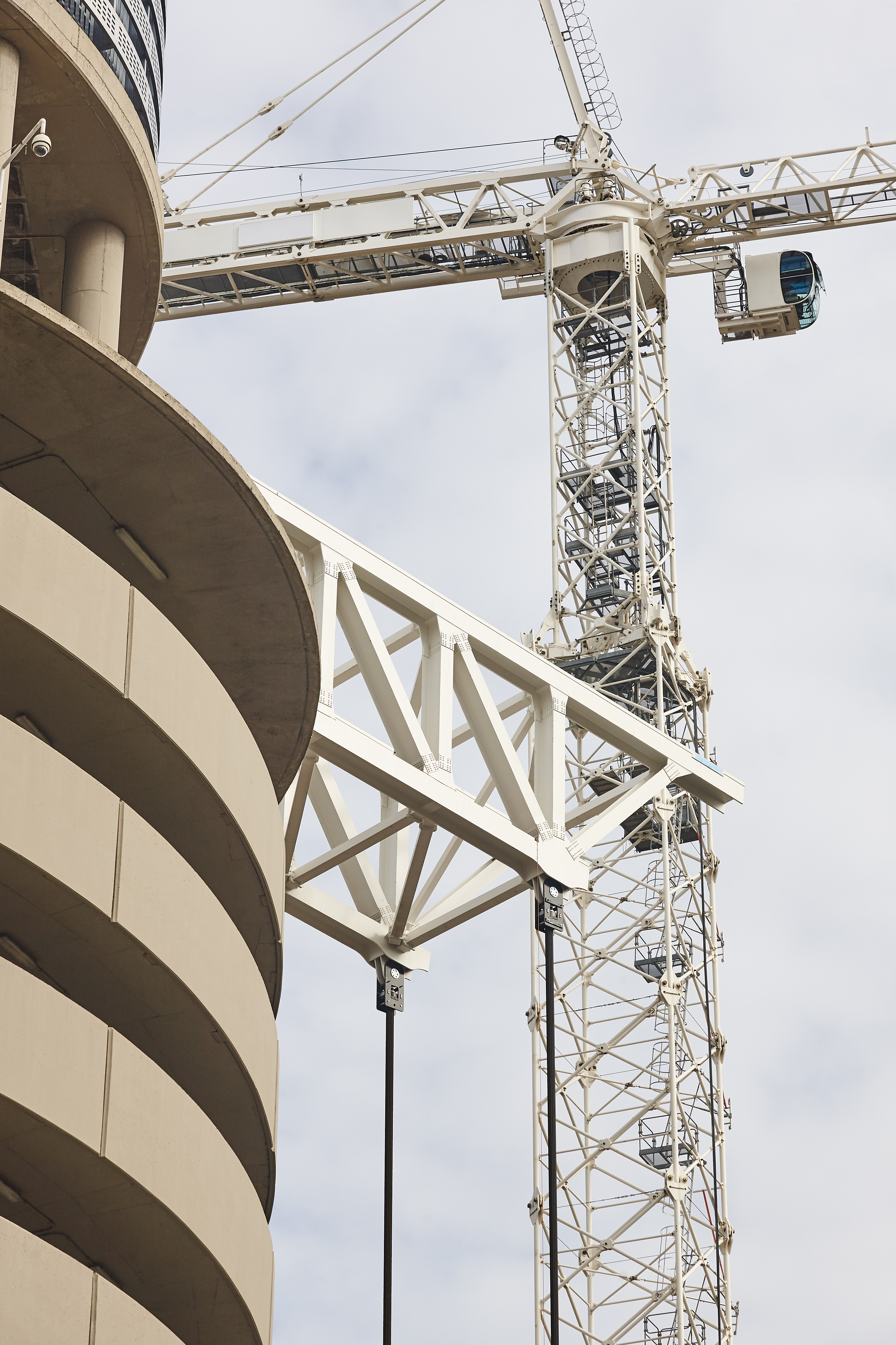 Telescopic cranes under a white sky. Construction engineering industry